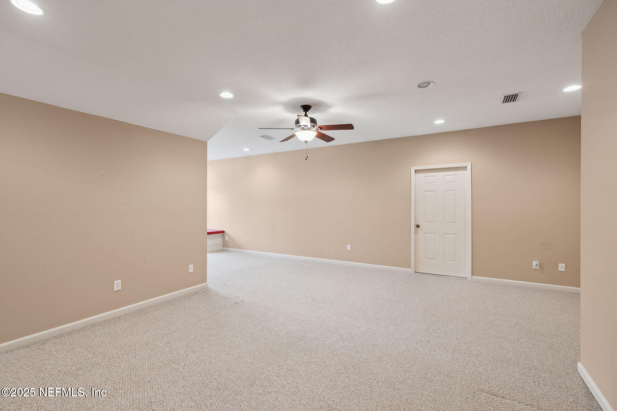 5802 Manning Cemetery Road Jacksonville, FL 32234 - Photo 55 of 117 an empty room with a ceiling fan and a window
