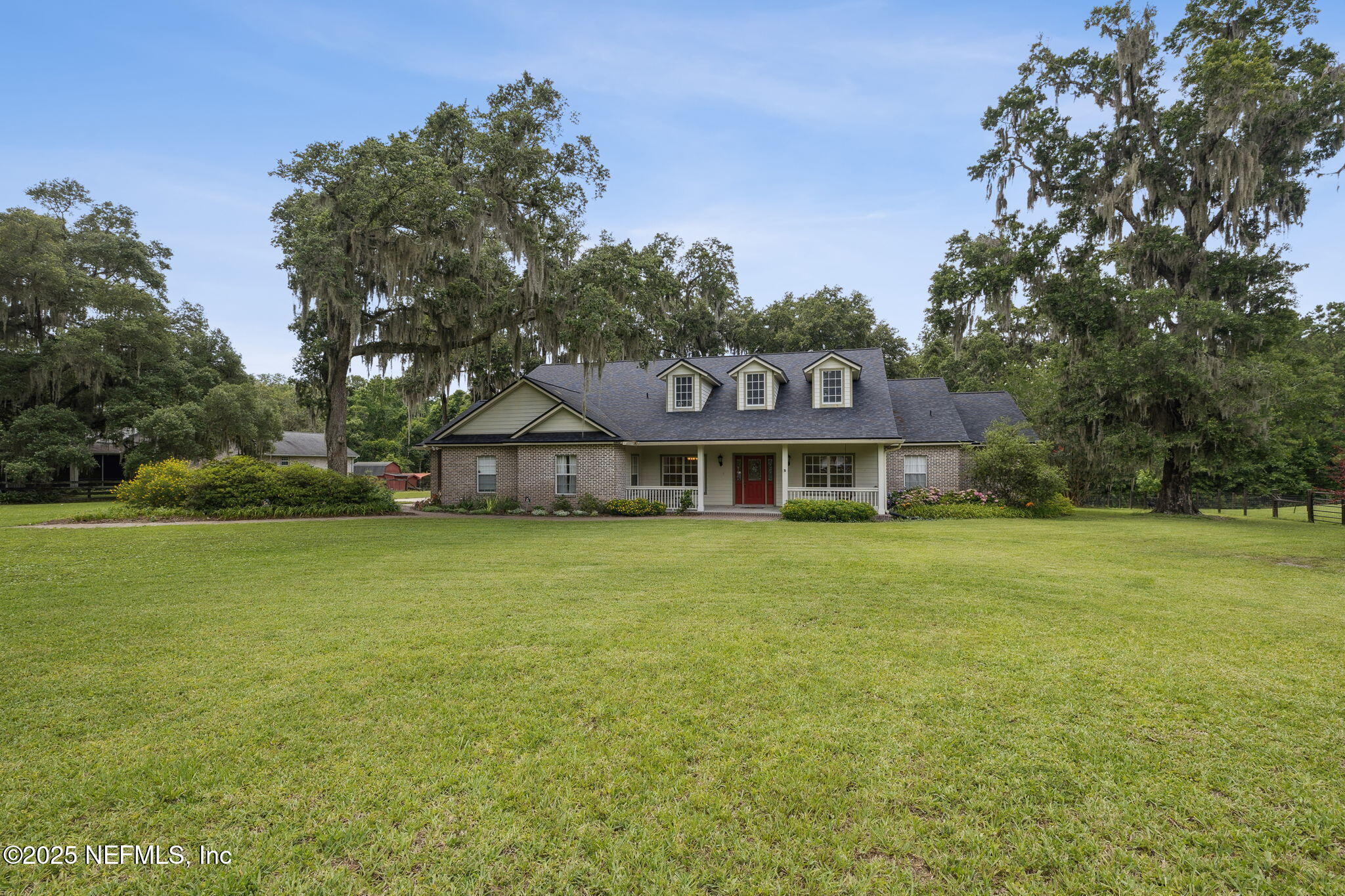 5802 Manning Cemetery Road Jacksonville, FL 32234 - Photo 74 of 117 a front view of a house with garden