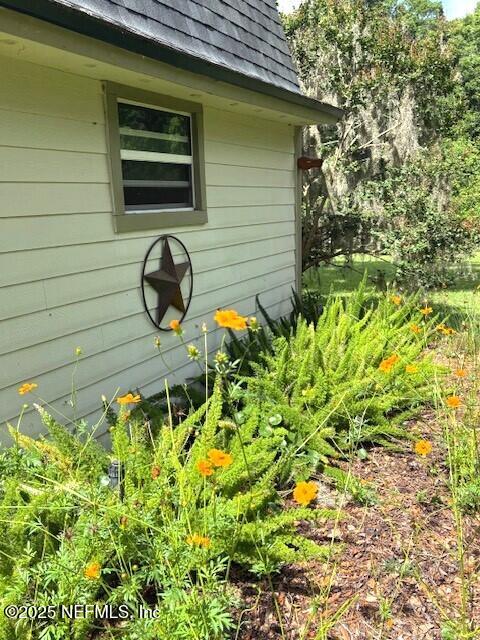 5802 Manning Cemetery Road Jacksonville, FL 32234 - Photo 81 of 117 a front view of a house with a yard and many windows