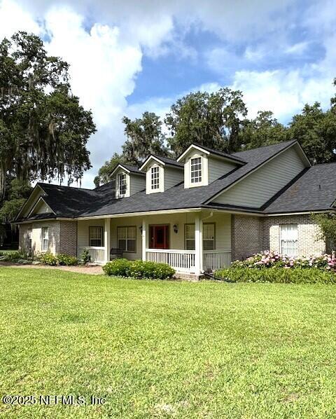 5802 Manning Cemetery Road Jacksonville, FL 32234 - Photo 91 of 117 a front view of a house with garden