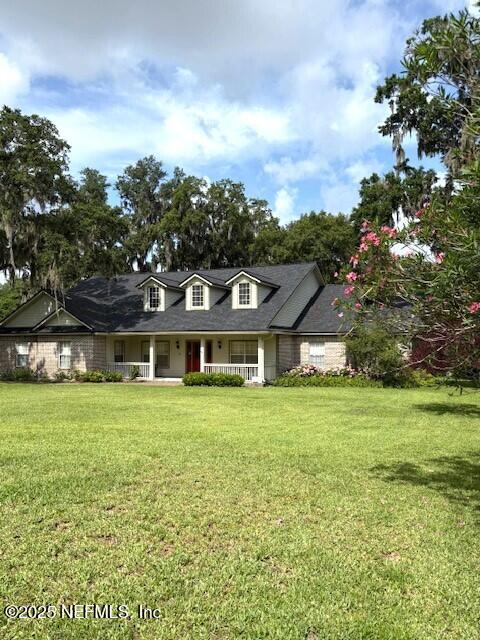5802 Manning Cemetery Road Jacksonville, FL 32234 - Photo 93 of 117 a front view of a house with a garden