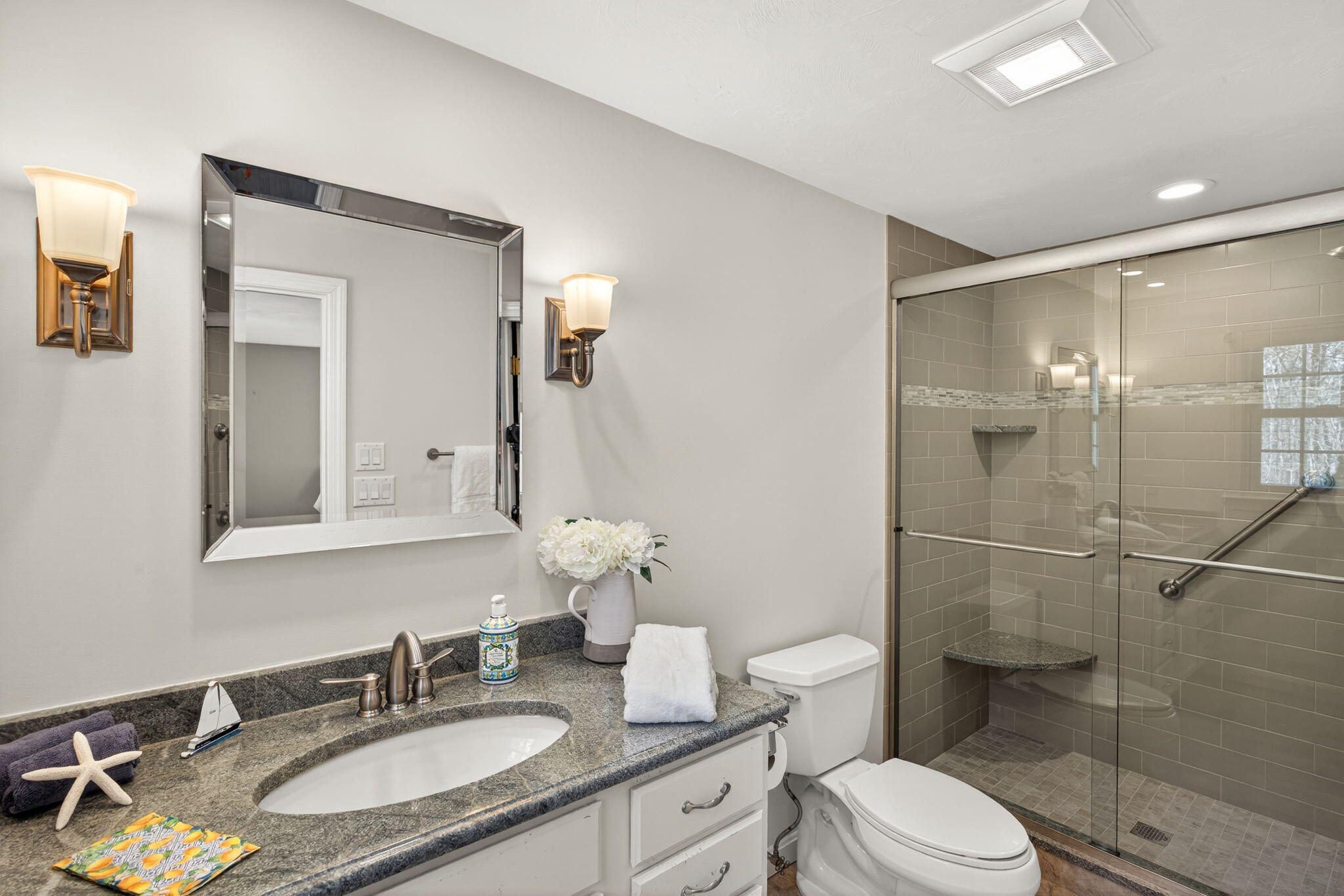 23 Dundee Circle Harwich, MA 02645 - Photo 13 of 33 a bathroom with a granite countertop sink toilet a mirror and shower