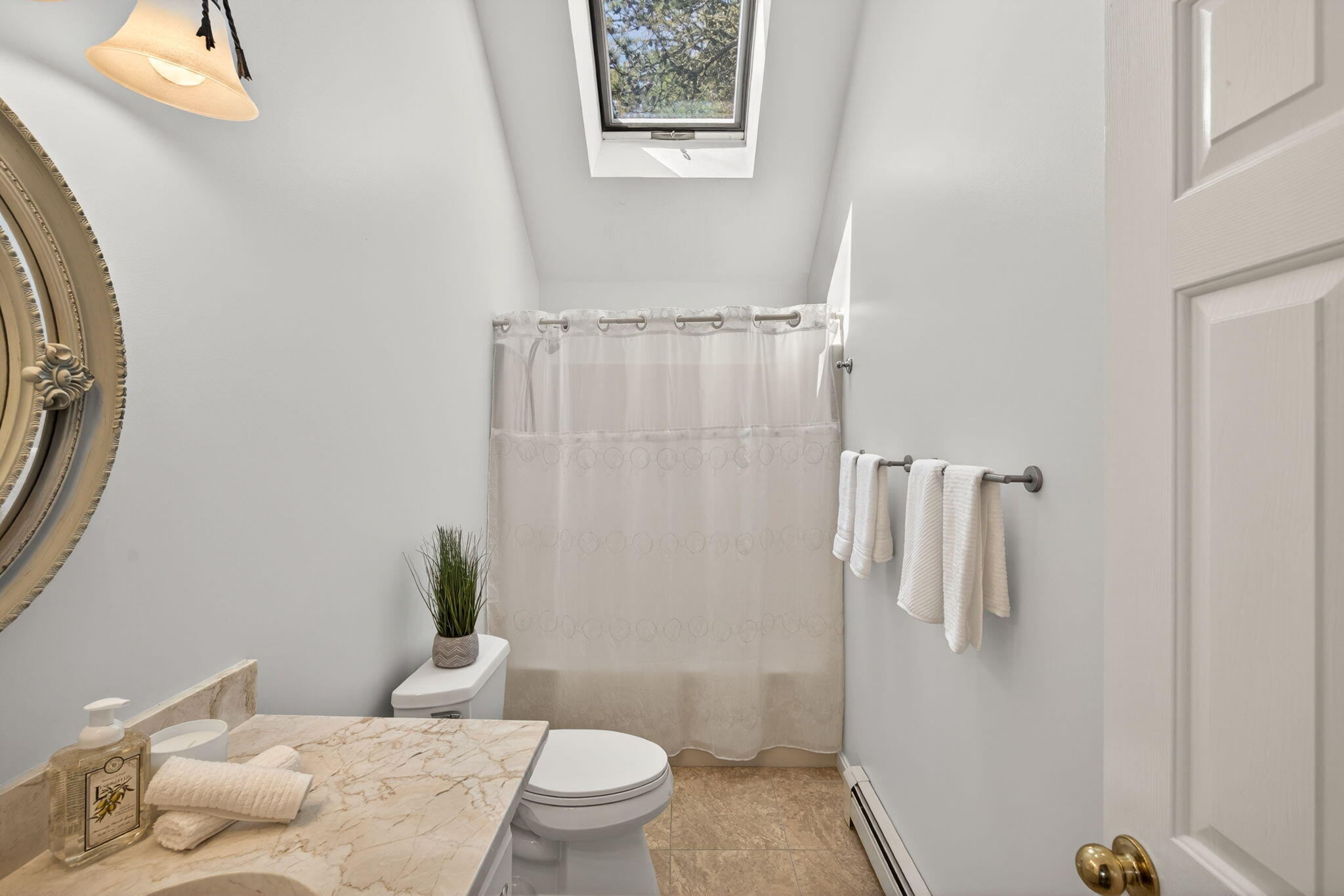 23 Dundee Circle Harwich, MA 02645 - Photo 15 of 33 a white toilet sitting next to a bathroom sink and a mirror