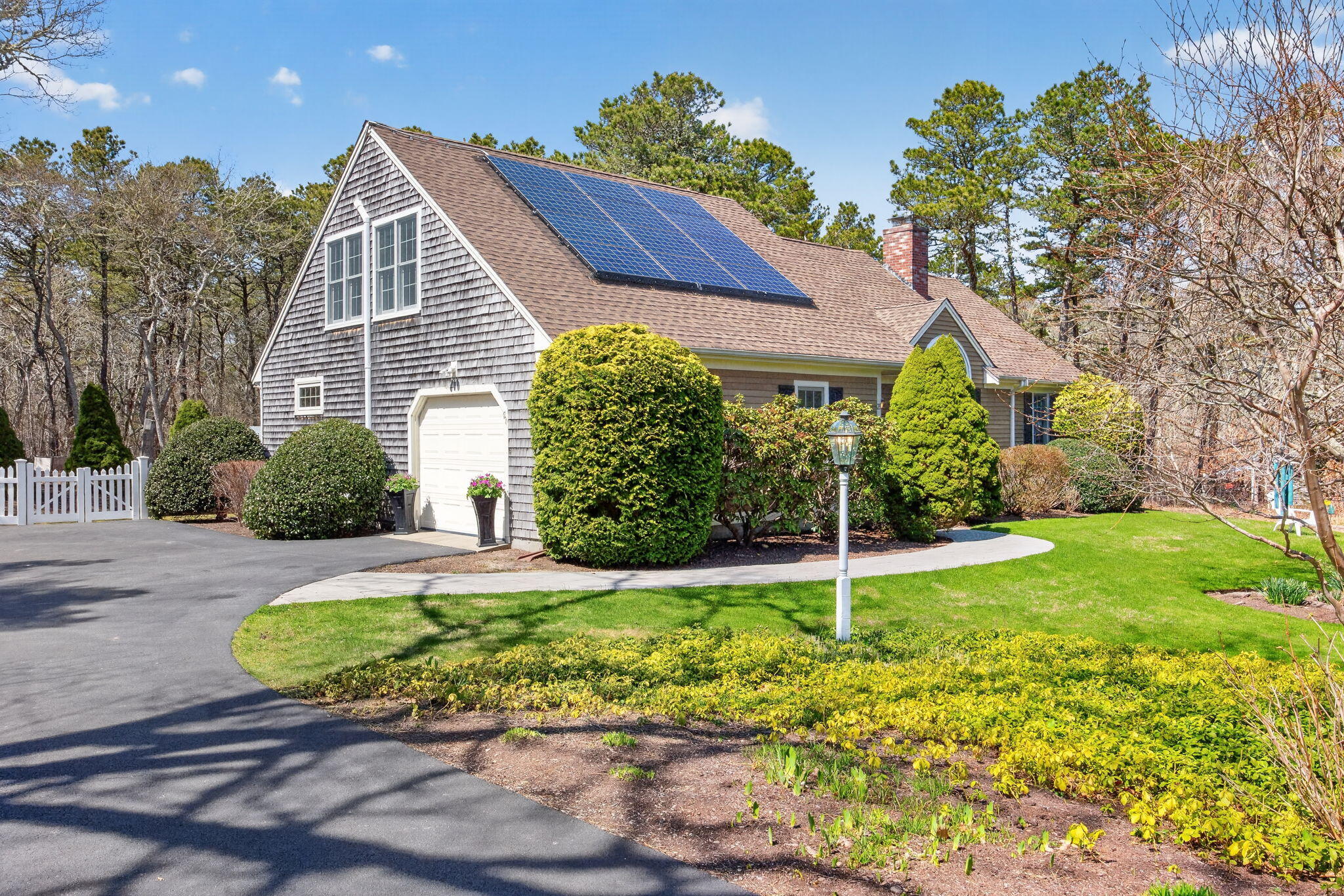 23 Dundee Circle Harwich, MA 02645 - Photo 2 of 33 a view of a house with a yard and potted plants