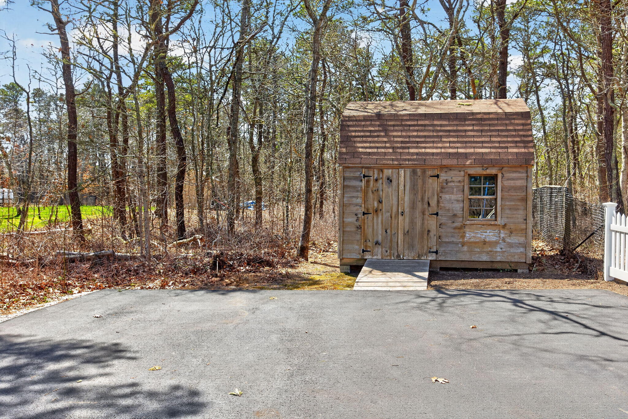 23 Dundee Circle Harwich, MA 02645 - Photo 24 of 33 a view of a house with backyard and trees