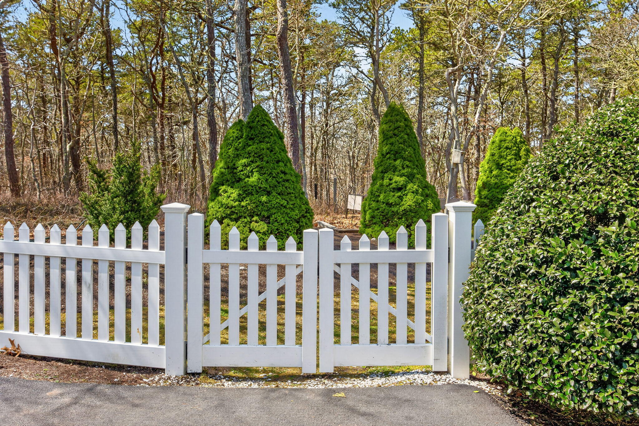 23 Dundee Circle Harwich, MA 02645 - Photo 25 of 33 a wooden fence with trees in the background