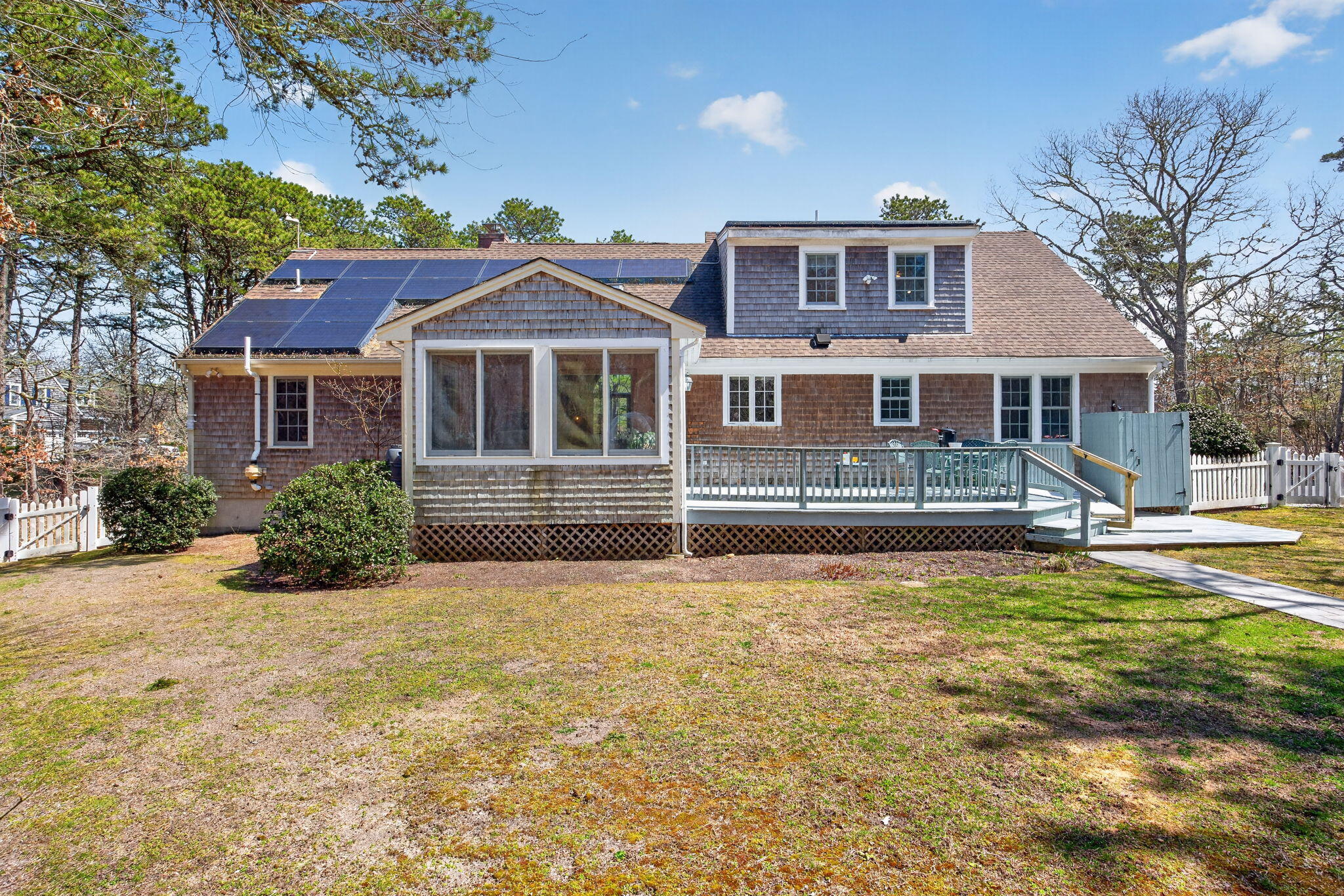 23 Dundee Circle Harwich, MA 02645 - Photo 3 of 33 a front view of a house with a yard