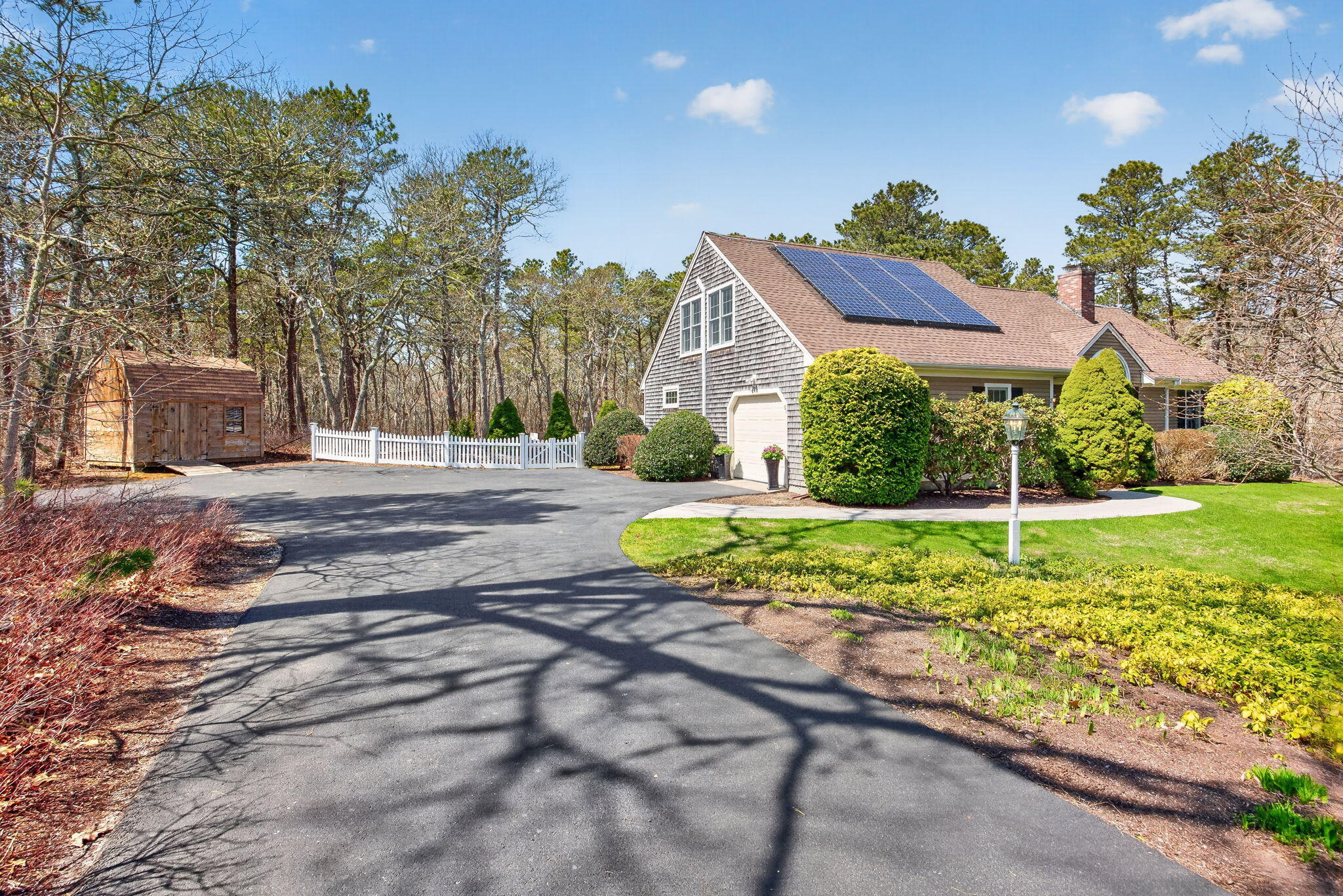 23 Dundee Circle Harwich, MA 02645 - Photo 33 of 33 a house with green field in front of it