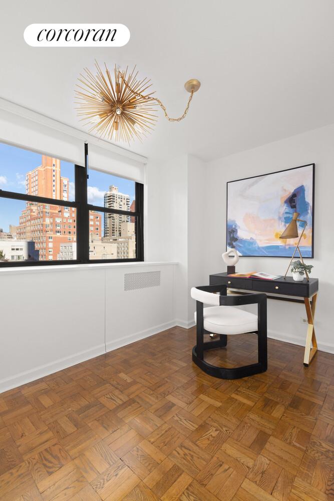 239 East 79th Street, Unit 12K Manhattan, NY 10075 - Photo 4 of 14 a living room with furniture