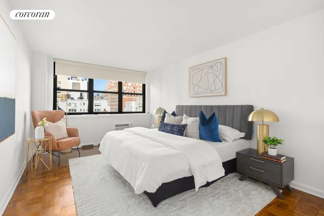 a bedroom with bed and a large window