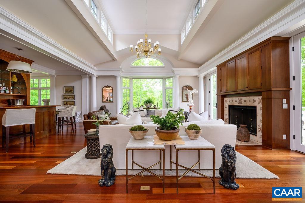 2408 Old Lynchburg Road Charlottesville, VA 22903 - Photo 12 of 71 a dining room with furniture a fireplace and wooden floor