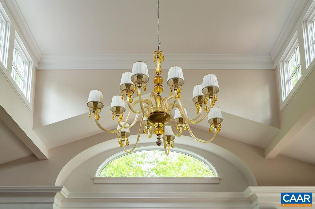 2408 Old Lynchburg Road Charlottesville, VA 22903 - Photo 14 of 71 a vase of flowers sitting on a table with window