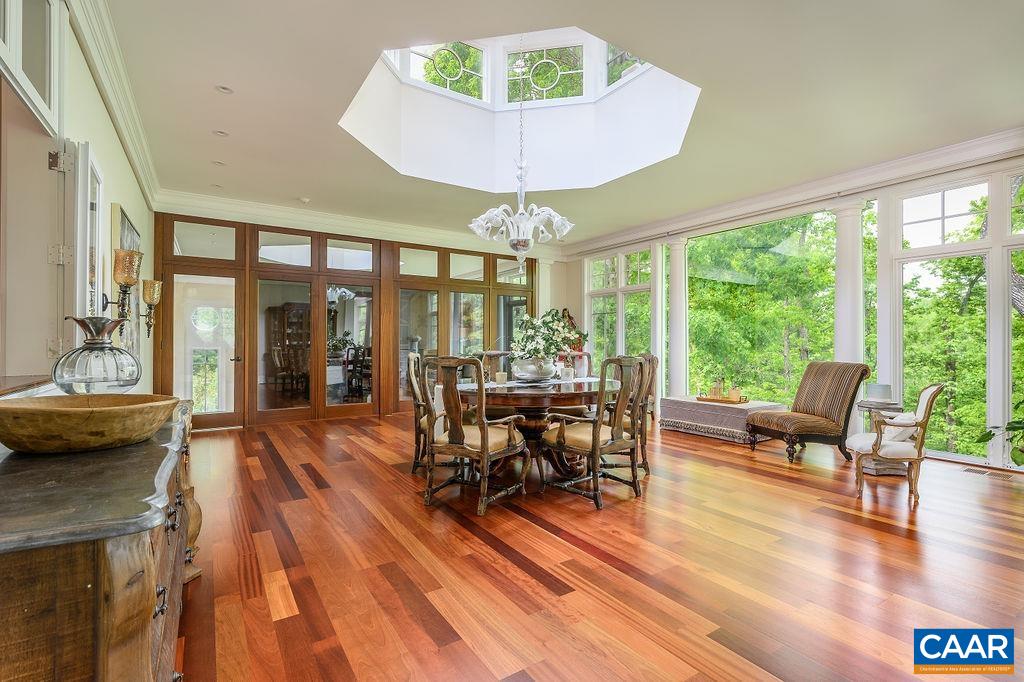 2408 Old Lynchburg Road Charlottesville, VA 22903 - Photo 17 of 71 a view of a dining room with furniture window and outside view