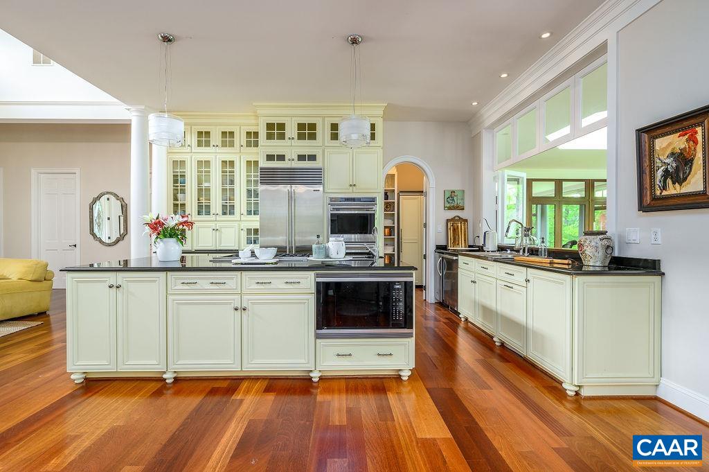 2408 Old Lynchburg Road Charlottesville, VA 22903 - Photo 22 of 71 a kitchen with stainless steel appliances granite countertop a stove a sink and a refrigerator