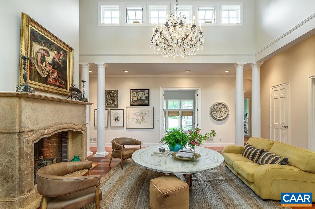 2408 Old Lynchburg Road Charlottesville, VA 22903 - Photo 24 of 71 a living room with furniture kitchen view and a fireplace