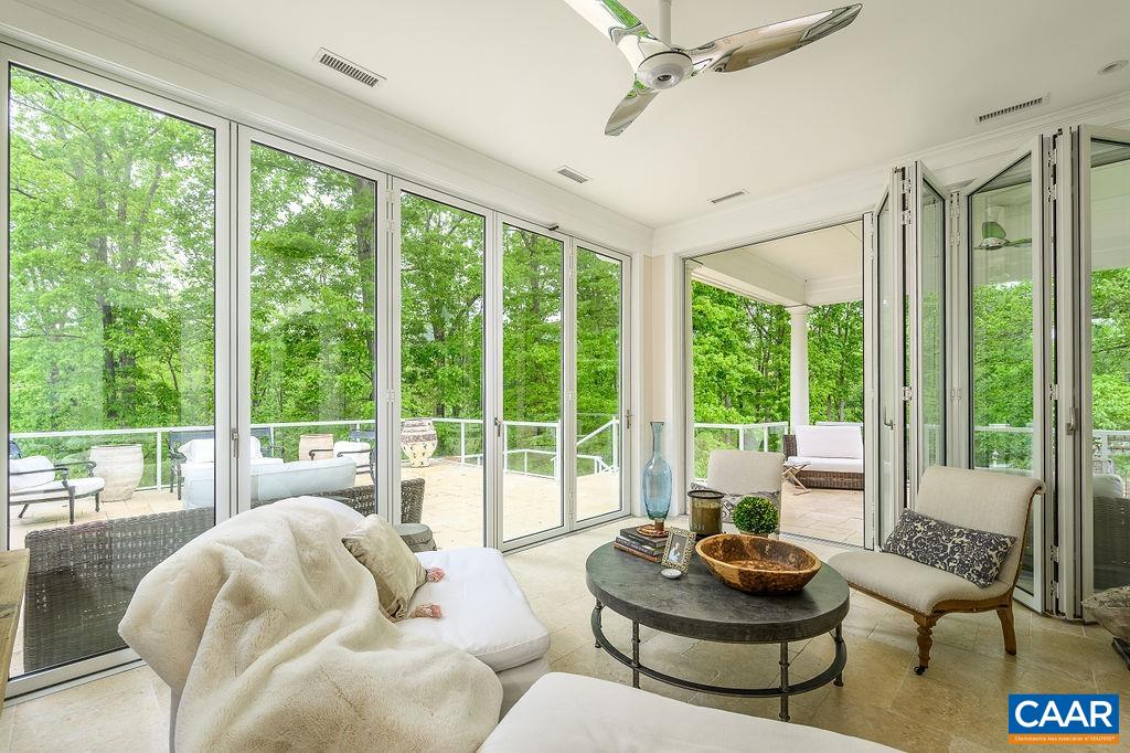 2408 Old Lynchburg Road Charlottesville, VA 22903 - Photo 34 of 71 a living room with furniture and a floor to ceiling window