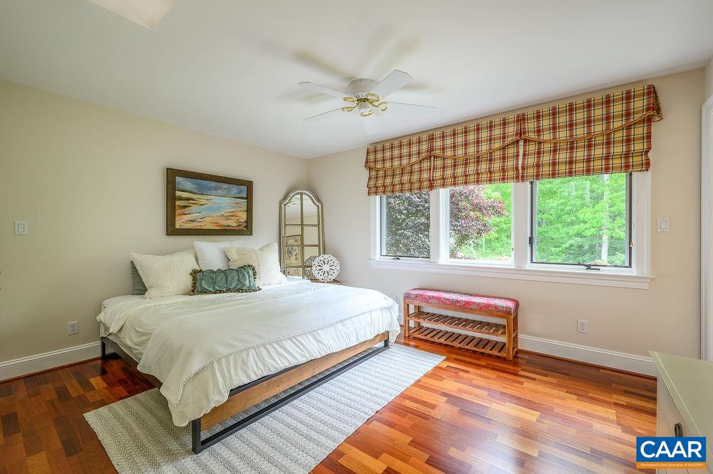 2408 Old Lynchburg Road Charlottesville, VA 22903 - Photo 36 of 71 a bedroom with a bed and a large window