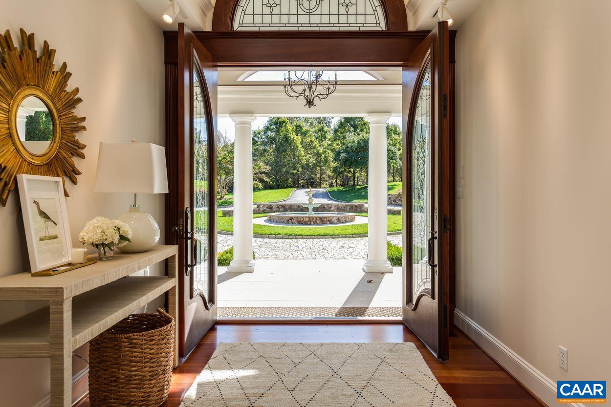 2408 Old Lynchburg Road Charlottesville, VA 22903 - Photo 4 of 71 a living room with a fireplace and a floor to ceiling window