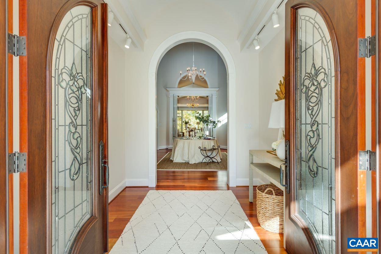 2408 Old Lynchburg Road Charlottesville, VA 22903 - Photo 5 of 71 a view of a hallway with wooden floor and a dining room