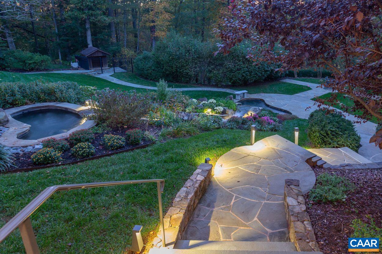 2408 Old Lynchburg Road Charlottesville, VA 22903 - Photo 56 of 71 a view of a garden with plants and a fountain