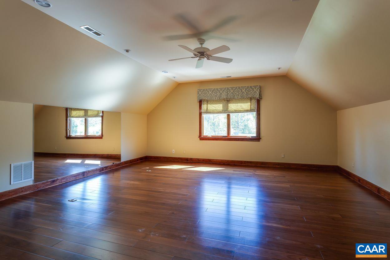 2408 Old Lynchburg Road Charlottesville, VA 22903 - Photo 63 of 71 a view of an empty room with a window and wooden floor