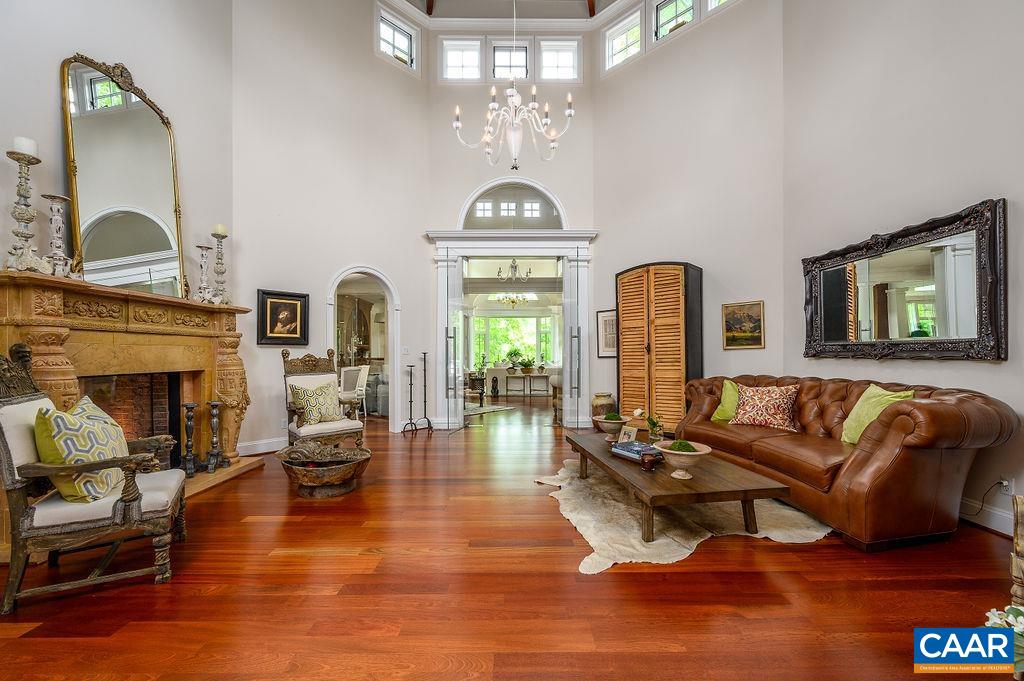 2408 Old Lynchburg Road Charlottesville, VA 22903 - Photo 8 of 71 a living room with fireplace furniture and a chandelier