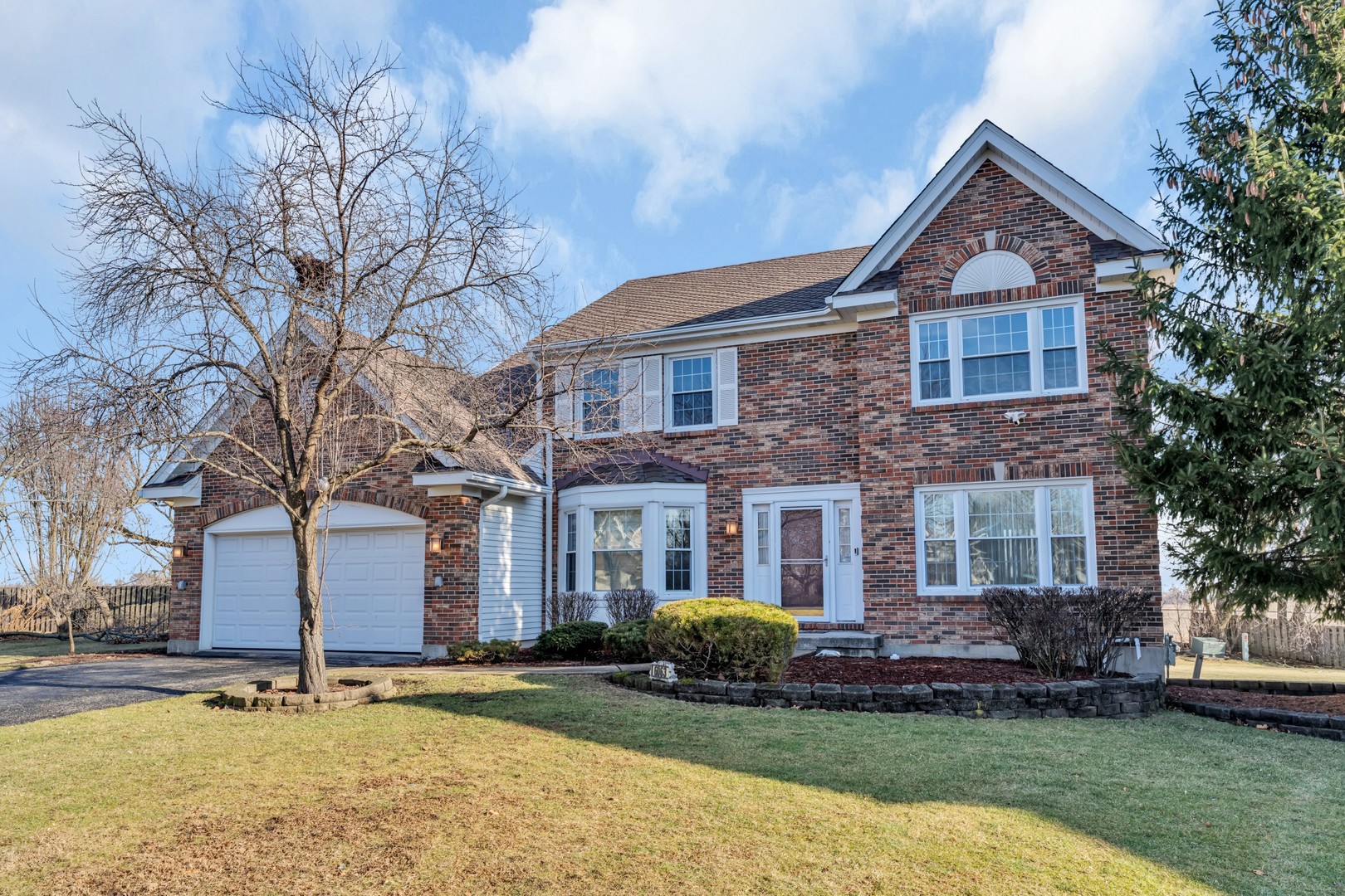 6063 Morningside Court Gurnee, IL 60031 - Photo 1 of 58 a front view of a house with a yard