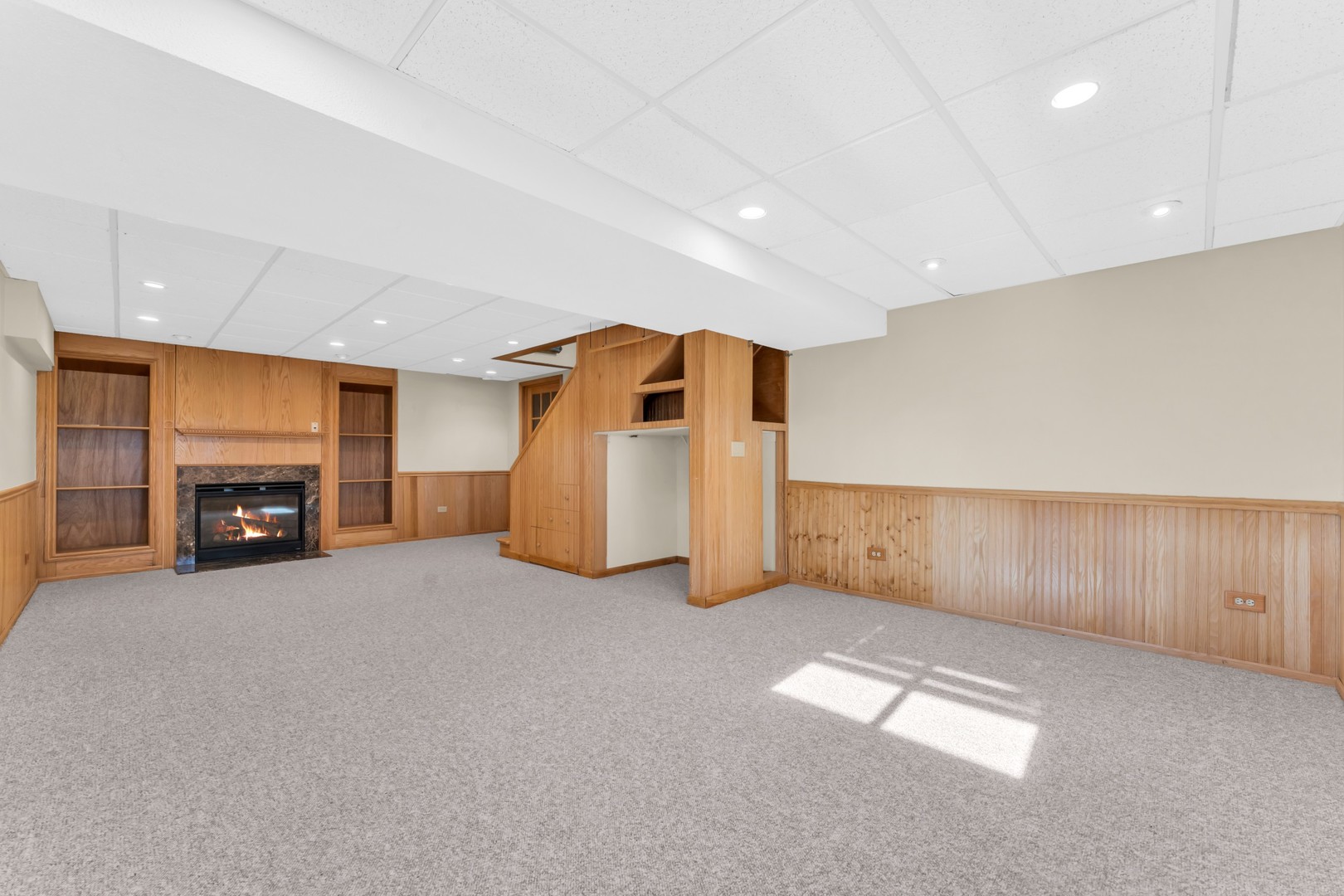 6063 Morningside Court Gurnee, IL 60031 - Photo 41 of 58 a view of an empty room with a fireplace