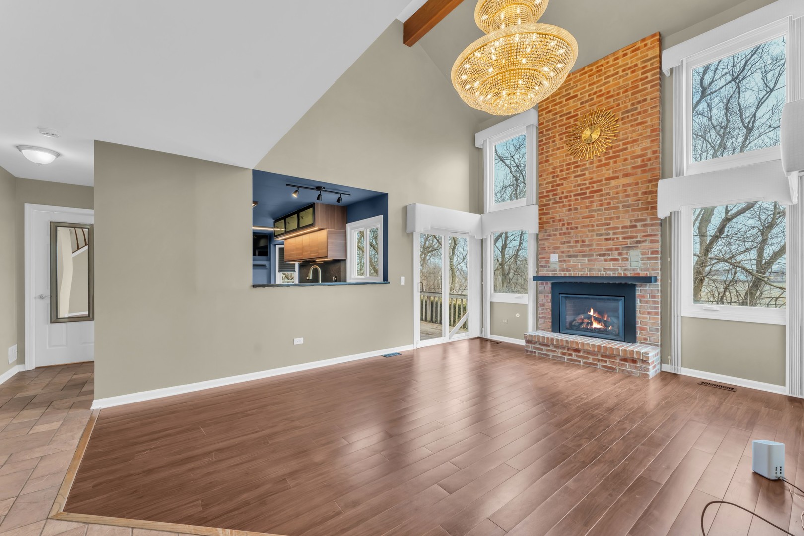 6063 Morningside Court Gurnee, IL 60031 - Photo 7 of 58 a view of an empty room with wooden floor and a window