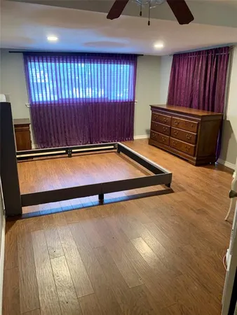 a view of room with stairs and wooden floor