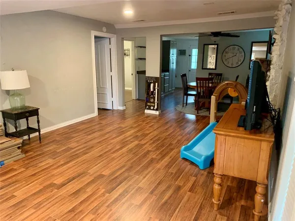 a view of a livingroom with furniture and wooden floor