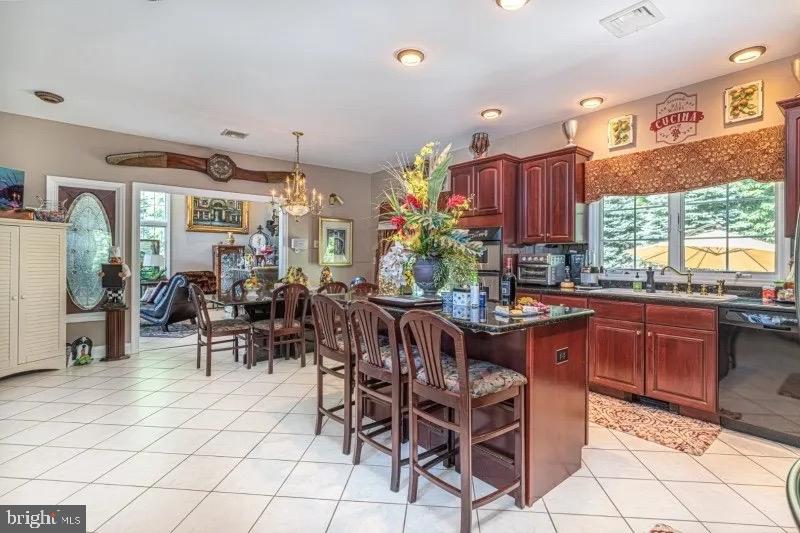 12 Upper Lake Road Oak Ridge, NJ 07438 - Photo 11 of 25 a view of a dining room with furniture window and outside view