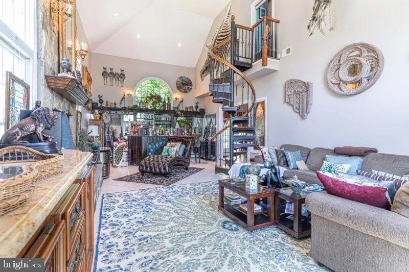 12 Upper Lake Road Oak Ridge, NJ 07438 - Photo 12 of 25 a living room with lots of furniture and a chandelier