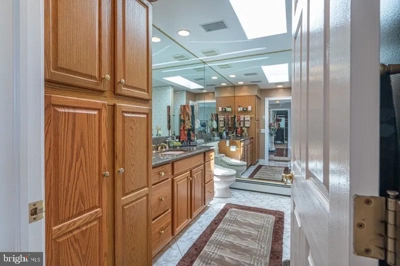 12 Upper Lake Road Oak Ridge, NJ 07438 - Photo 14 of 25 a kitchen with stainless steel appliances granite countertop a refrigerator and cabinets