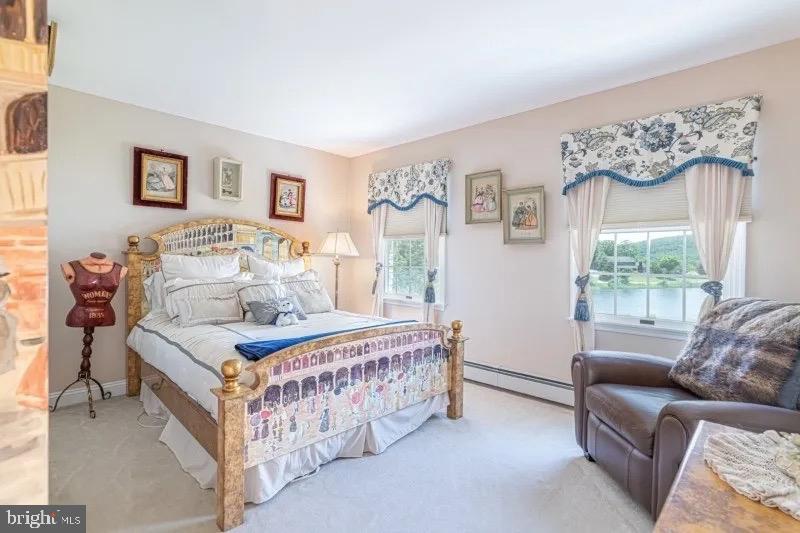 12 Upper Lake Road Oak Ridge, NJ 07438 - Photo 15 of 25 a bedroom with bed and a couch