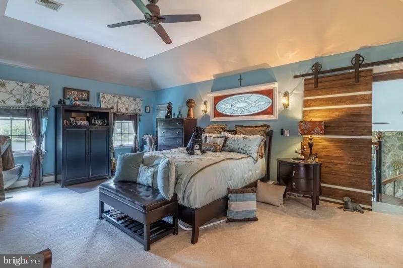 12 Upper Lake Road Oak Ridge, NJ 07438 - Photo 18 of 25 a bed sitting in a room next to a window