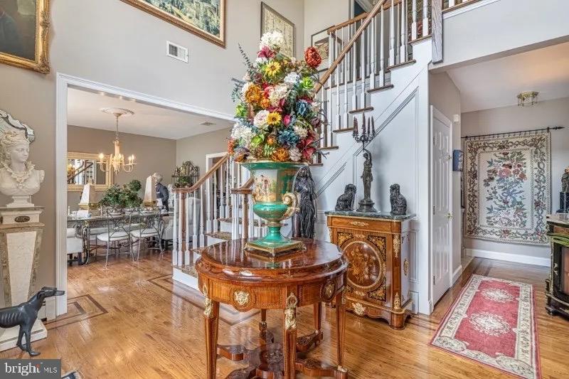 12 Upper Lake Road Oak Ridge, NJ 07438 - Photo 6 of 25 a living room with fireplace furniture dining table and a chandelier