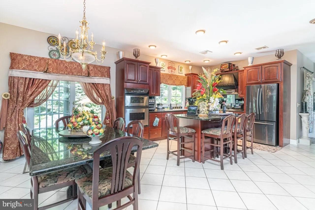12 Upper Lake Road Oak Ridge, NJ 07438 - Photo 10 of 25 a view of a dining room with furniture window and outside view