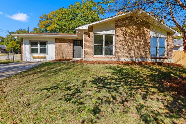 front view of a house with a yard