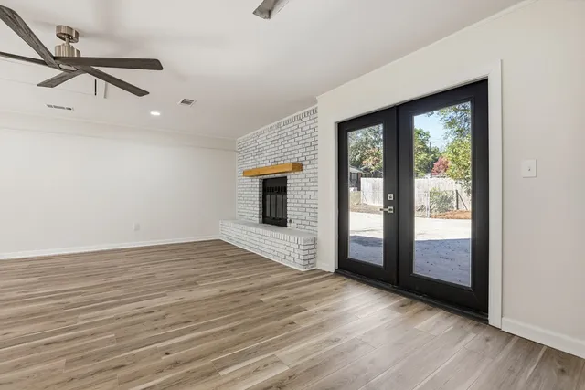 a view of an empty room with glass door