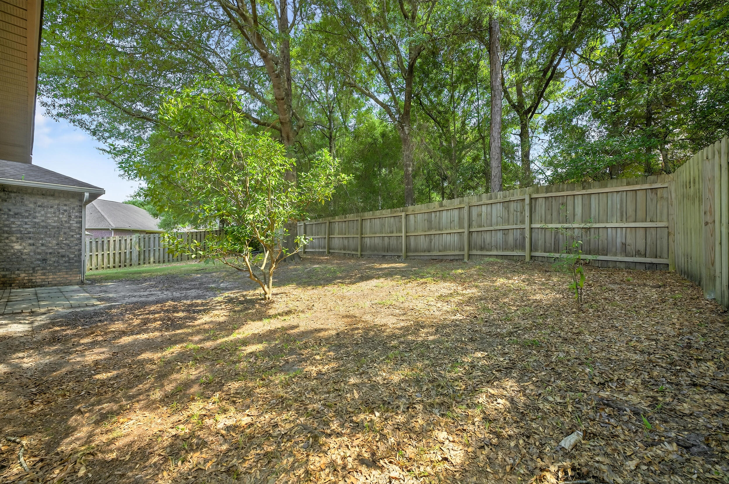 603 Red Fern Road Crestview, FL 32536 - Photo 54 of 67 a view of a backyard with a small cabin