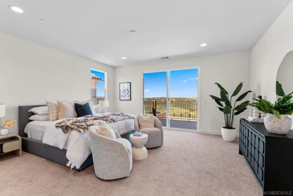 an aerial view of a house with swimming pool and outdoor seating