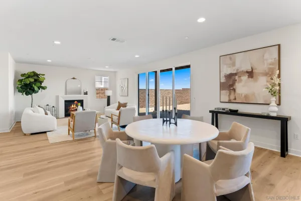 a large kitchen with kitchen island a counter top space a sink stainless steel appliances and cabinets