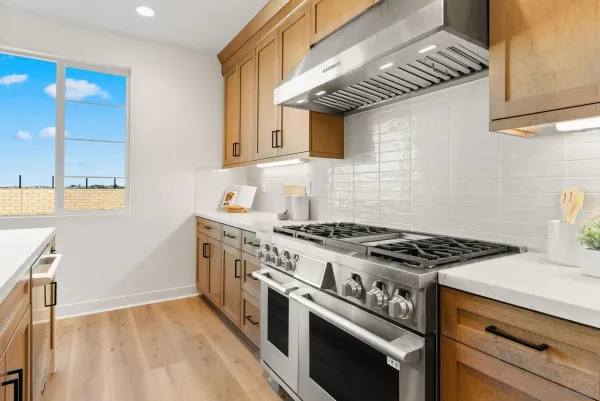 a bathroom with a tub a sink and a large mirror