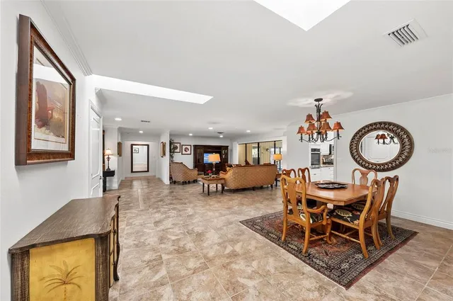 a kitchen with granite countertop a stove sink and microwave