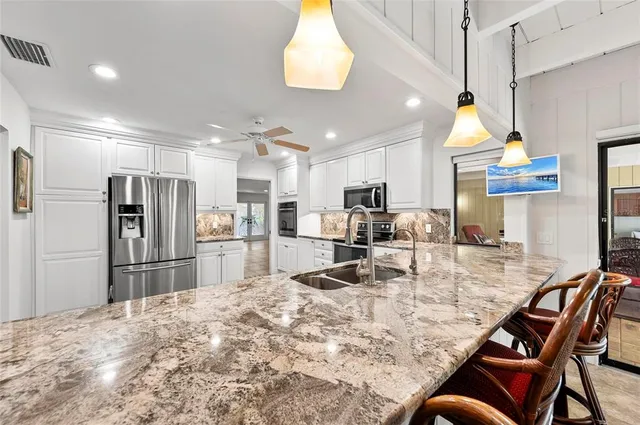 a living room with furniture fireplace and flat screen tv