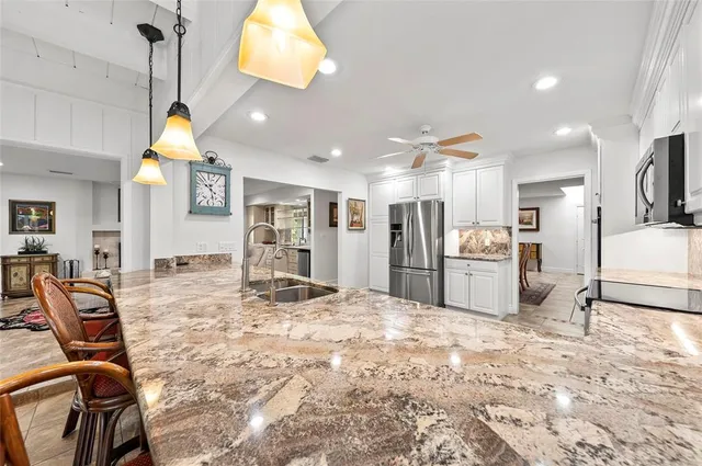 a view of a dining room and hall with furniture