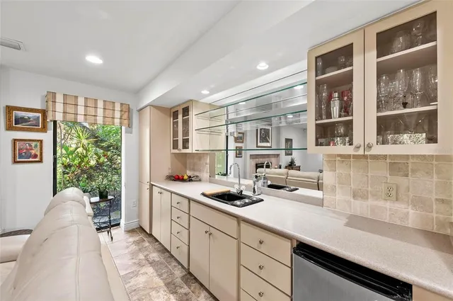 a view of a hallway with painting on the wall