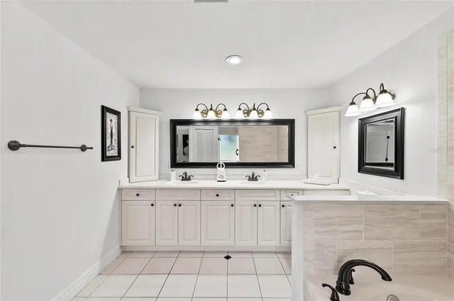 a living room with patio furniture and a large window
