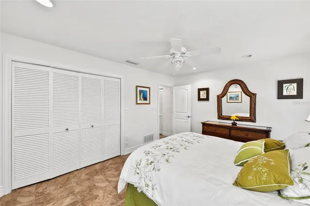 a living room with furniture a fireplace and a large window